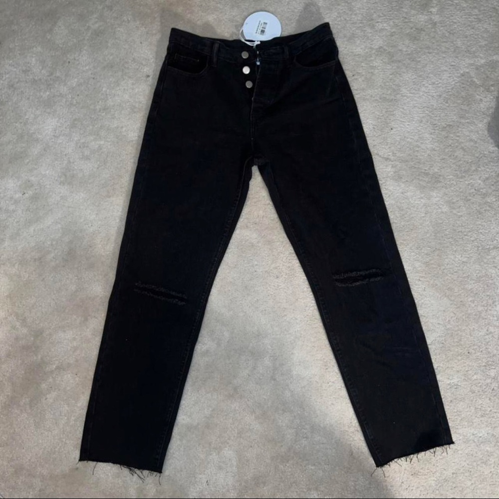 Black jeans with ripped knees